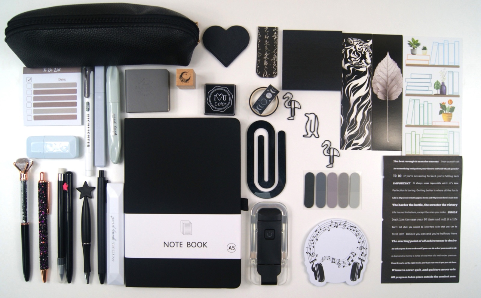 Signature Collection in Black with the full colour-coordinated stationery set laid out on a pale background