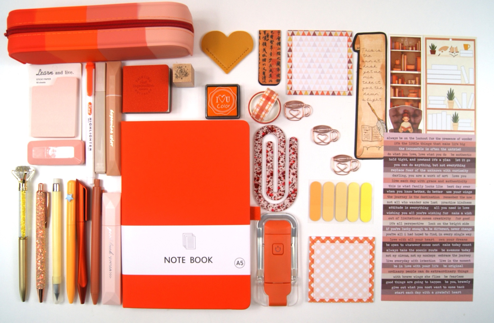 Signature Collection in Orange with the full colour-coordinated stationery set laid out on a pale background
