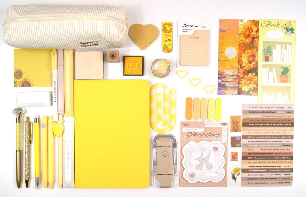 Signature Collection in Yellow with the full colour-coordinated stationery set laid out on a pale background