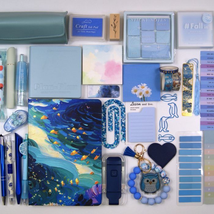 The Indulgence Collection in Ocean Blue, showing colour-coordinated stationery and reading accessories laid out on a pale background
