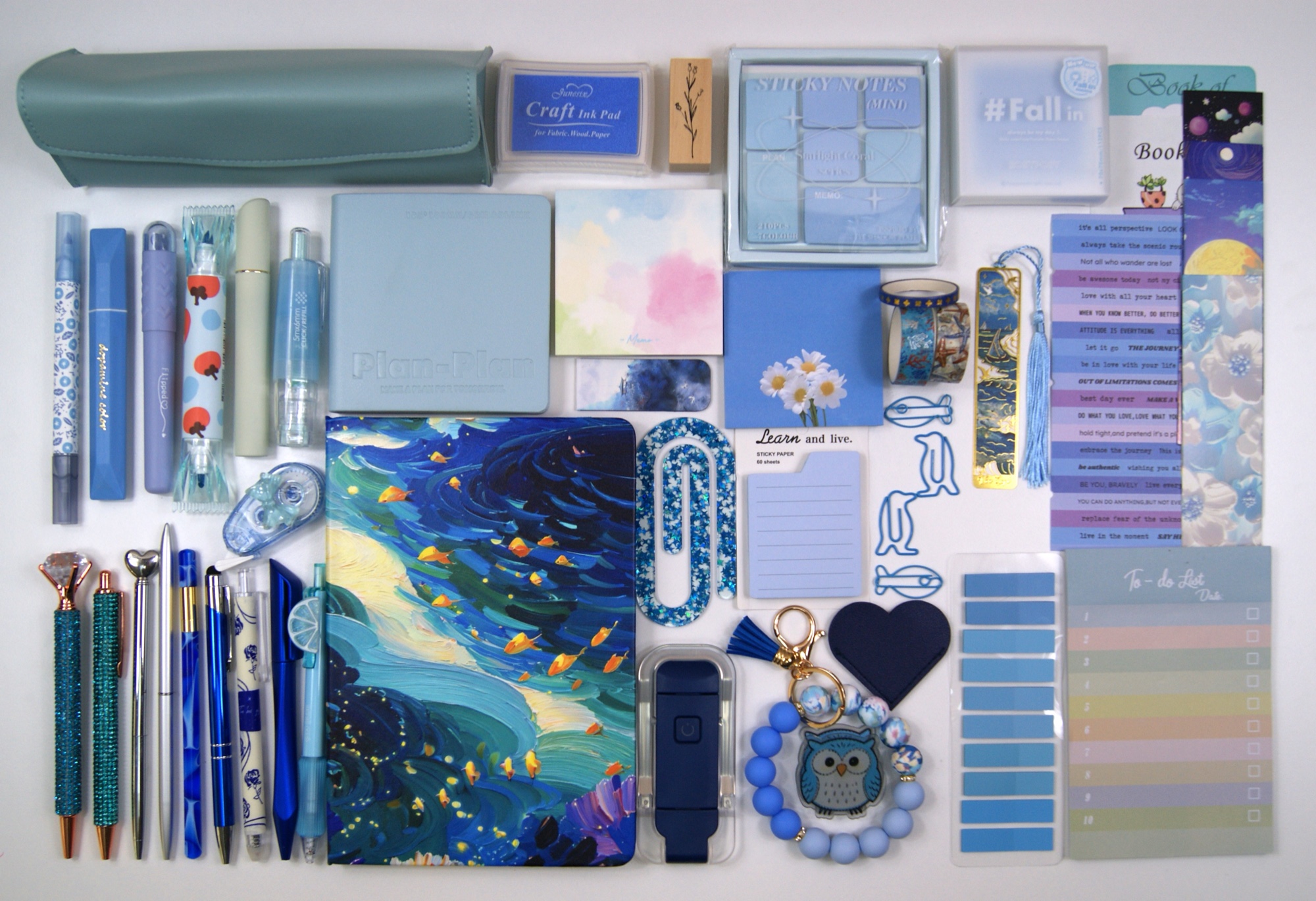 The Indulgence Collection in Ocean Blue, showing colour-coordinated stationery and reading accessories laid out on a pale background