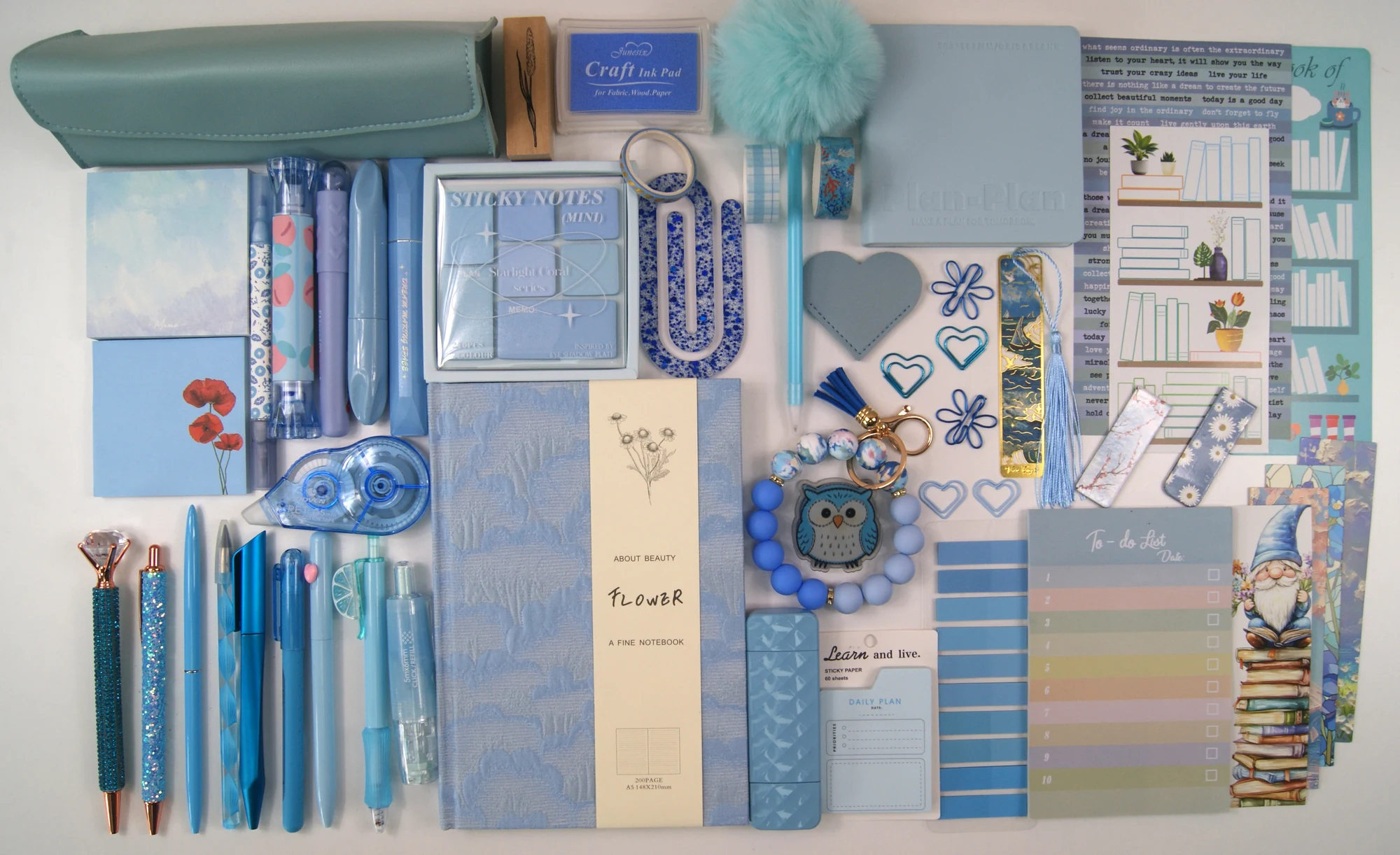 Indulgence Collection in Powder Blue Haze with colour-coordinated stationery arranged in a flat lay
